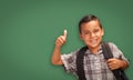 Cute Hispanic Boy In Front of Blank Chalk Board Royalty Free Stock Photo