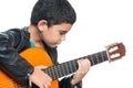 Cute hispanic boy playing an acoustic guitar Royalty Free Stock Photo