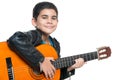 Cute hispanic boy playing an acoustic guitar Royalty Free Stock Photo