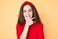 Cute hispanic child girl wearing casual clothes and diadem looking confident at the camera smiling with crossed arms and hand Royalty Free Stock Photo