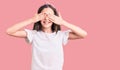 Cute hispanic child girl wearing casual white tshirt covering eyes with hands smiling cheerful and funny Royalty Free Stock Photo