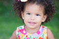 Cute hispanic girl with an afro hairstyle smiling Royalty Free Stock Photo