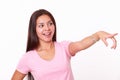 Cute hispanic girl pointing to her left Royalty Free Stock Photo