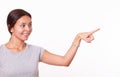 Cute hispanic lady pointing to her left Royalty Free Stock Photo