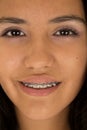 Cute Hispanic teen girl wearing braces on her teeth smiling Royalty Free Stock Photo