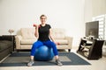 Cute Hispanic woman exercising at home Royalty Free Stock Photo