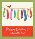 Cute holiday card with string of colorful patterned Christmas stockings.