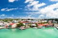 Cute houses with yacht, boat at harbor, St. John, Antigua Royalty Free Stock Photo