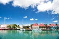 Cute houses with yacht, boat at harbor, St. John, Antigua Royalty Free Stock Photo