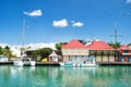 Cute houses with yacht, boat at harbor, St. John, Antigua Royalty Free Stock Photo