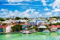 Cute houses with yacht, boat at harbor, St. John, Antigua Royalty Free Stock Photo