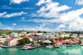 Cute houses with yacht, boat at harbor, St. John, Antigua Royalty Free Stock Photo