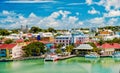 Cute houses with yacht, boat at harbor, St. John, Antigua Royalty Free Stock Photo