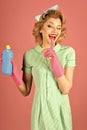 Cute housewife with cleaning sprayer