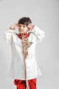 Cute Indian / Asian little boy in ethnic wear and Saluting national flag Royalty Free Stock Photo