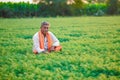 Cute Indian baby boy playing at gardenIndian farmer at the chickpea field Royalty Free Stock Photo