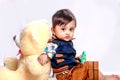 Cute Indian baby child playing with toy Royalty Free Stock Photo