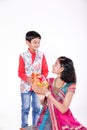 Cute Indian brother and sister celebrating raksha bandhan festival ,