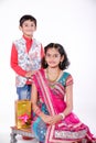 Cute Indian brother and sister celebrating raksha bandhan festival ,