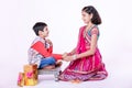 Cute Indian child brother and sister celebrating raksha bandhan festival , Royalty Free Stock Photo