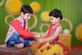 Cute Indian child brother and sister celebrating raksha bandhan festival , Royalty Free Stock Photo