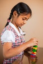 Cute Indian kid playing with puzzle toys