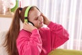 Cute indie girl in headphones listening music at home Royalty Free Stock Photo