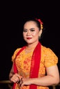 Cute Indonesian woman with red lips and a red scarf wearing a traditional Sundanese dress called kebaya Royalty Free Stock Photo