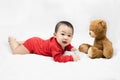 Cute infant baby boy toddler in red bodysuit.Concept holiday Christmas, happy new year, infants, childhood