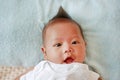 Cute infant baby boy in towel lying on bed after bath Royalty Free Stock Photo