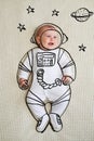 Cute infant baby girl sketched as astronaut