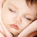 Cute infant baby sleeping, beautiful kid`s face closeup Royalty Free Stock Photo