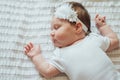 Cute Infant Child Sleeping On White Sheets