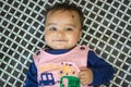 cute infant facial expressing from top angle indoor shot