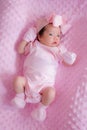 Portrait of a cute Asian newborn baby girl in pink dress Royalty Free Stock Photo