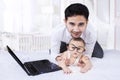 Cute infant wearing round glasses on bed Royalty Free Stock Photo