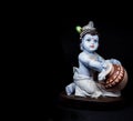 Cute and innocent idol of Hindu God Lord Krishna Royalty Free Stock Photo