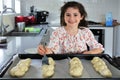 Cute Jewish girl baking sweet Challah bread for Sabbath Jewish Holiday Royalty Free Stock Photo