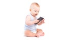 Cute joyful baby boy in blue shirt and diaper hold cellphone