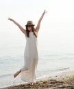 Cute joyful woman spend summer holidays on a sea beach