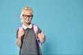 Cute Junior Schoolgirl with Glasses Shows Like Thumbs Up