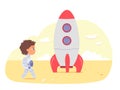 Cute kid astronaut with space rocket, boy cosmonaut in spacesuit walking on alien planet