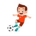 cute kid boy play soccer as striker Royalty Free Stock Photo