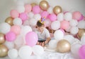 Cute kid boy smiling and taking selfie photo on cellphone  with balloon. Birthday party Royalty Free Stock Photo