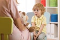 Cute kid boy at speech therapist office Royalty Free Stock Photo