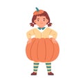 Cute kid disguised in pumpkin costume for Halloween carnival. Happy child in autumn party outfit. Funny little girl