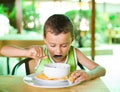 Cute kid eating soup Royalty Free Stock Photo