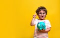 Cute kid girl holding dollars and have an idea how earning much money in crisis. Serious child teaching in eyeglasses Royalty Free Stock Photo