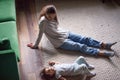 Cute kid girl lying on warm floor relaxing with mom Royalty Free Stock Photo