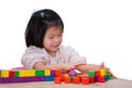 Cute Kid Girl is Playing with Colorful Wooden Blocks Placed on the Table, Children have Fun with Imagination, Construction, Royalty Free Stock Photo